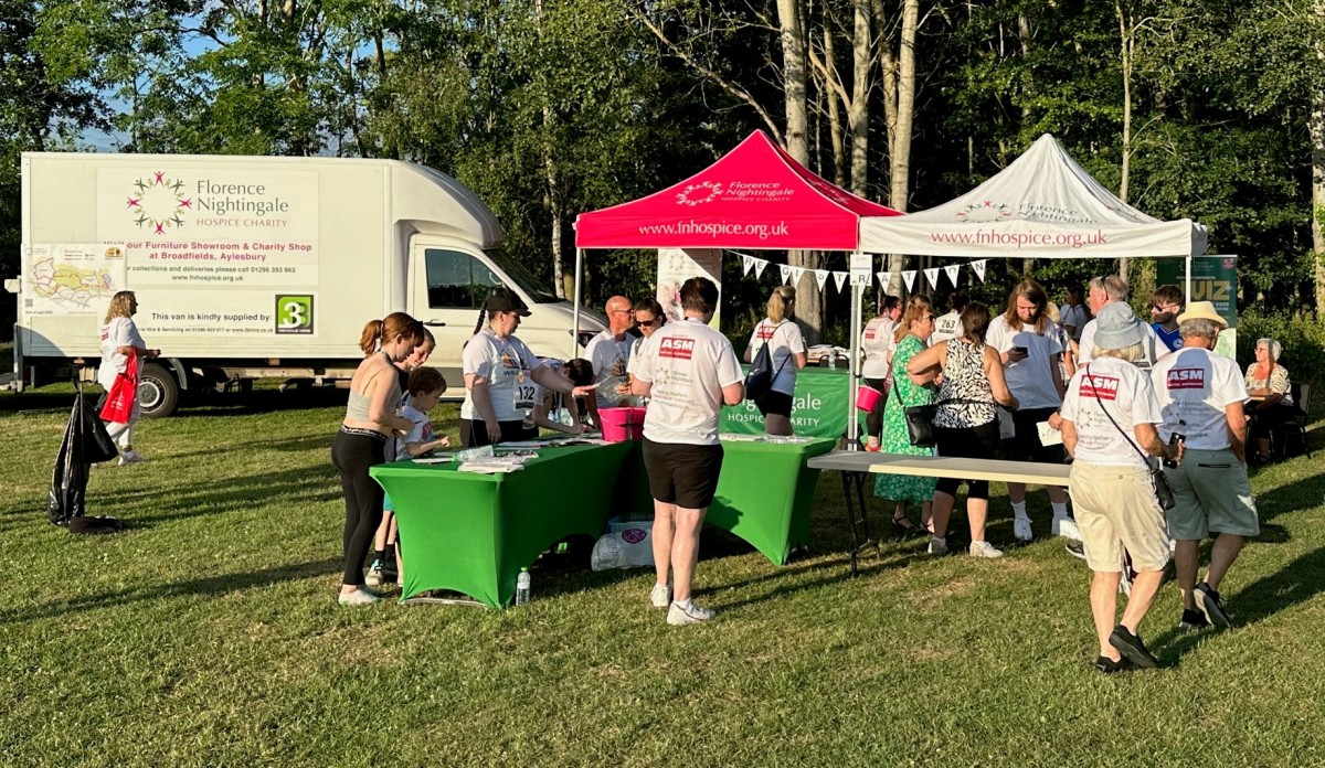 People gathered at registration point for Florence Nightingale Hospice Charity Walk Of Light event