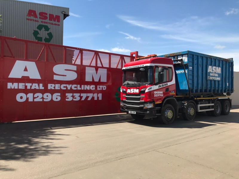 ASM roll-on-roll-off scrap metal truck against Aylesbury entrance