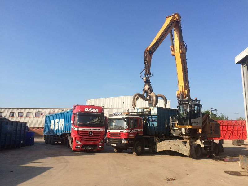 ASM lorries parked beside grab machine