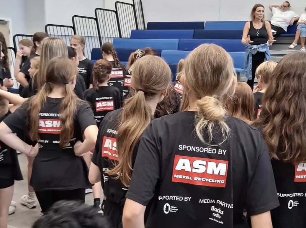 Performers rehearse for School Of Rock with ASM sponsored t-shirts